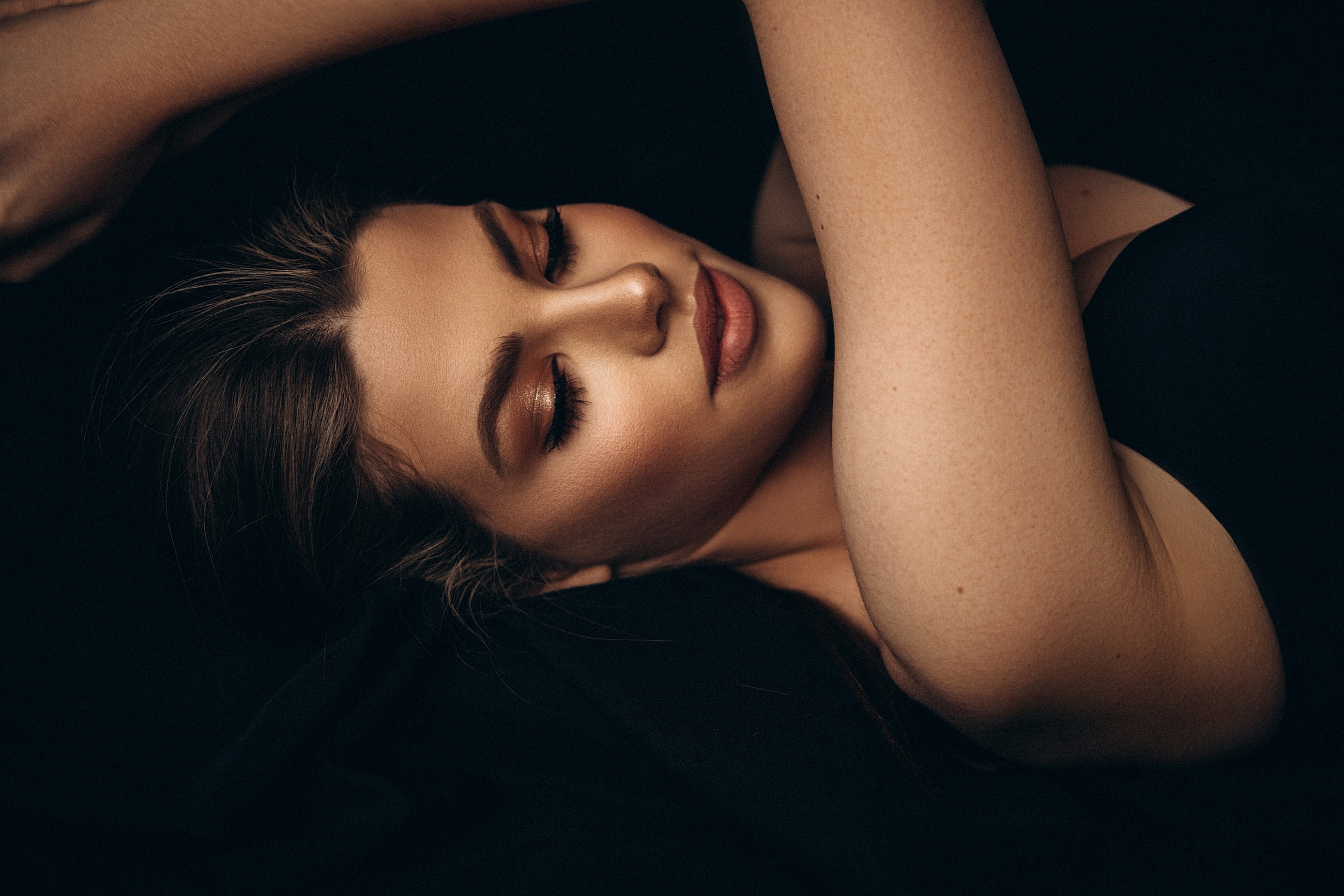 Close-up of a serene woman relaxing.